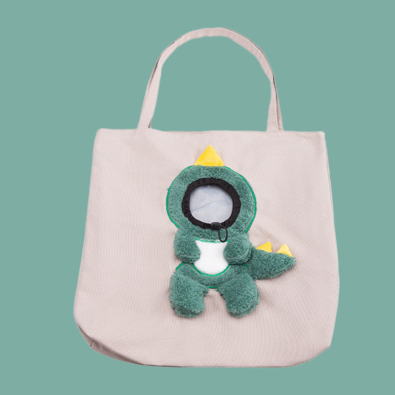 Light pet carrier tote bag with green plush animal face applique