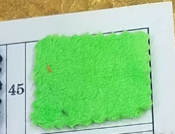 Flannel pet blanket swatch, bright neon green fuzzy texture