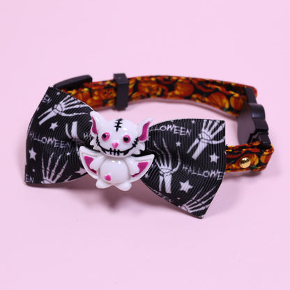 Small pet collar with safety buckle, black star print bow and white skeleton cat charm