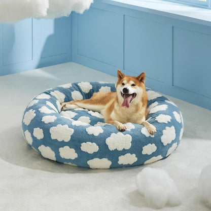 Blue round donut dog cat bed with white cloud spots, plush interior
