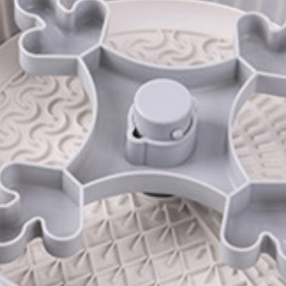 Interior of gray rotating feeder with textured slow-eating surface and spinner