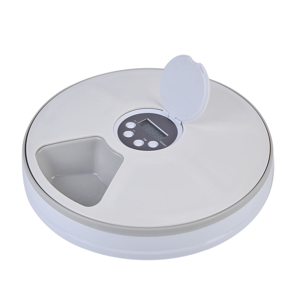 White timed pet feeding machine with raised food compartments and lid