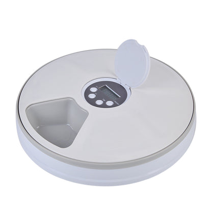 White timed pet feeding machine with raised food compartments and lid