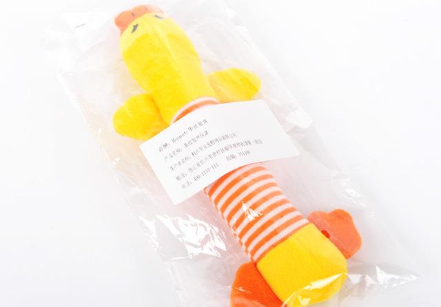 Funny dog squeak plush toy in yellow with orange accents and striped body