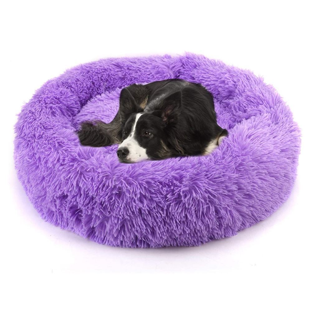 Purple plush round pet bed with dog resting inside