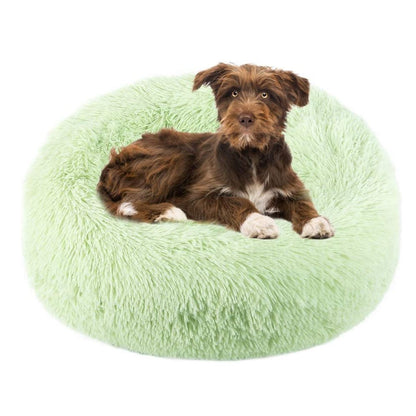 Light green round plush pet bed with curved bolster