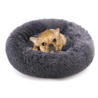 Dark gray round plush pet bed with shag texture and bolster
