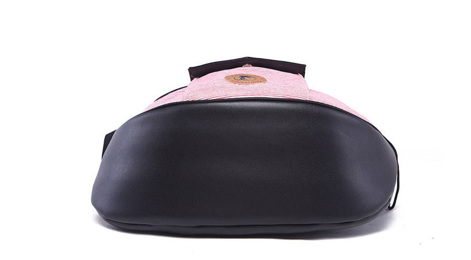 Pink Pet travel bag: rounded black base with pink-striped top panel and logo patch