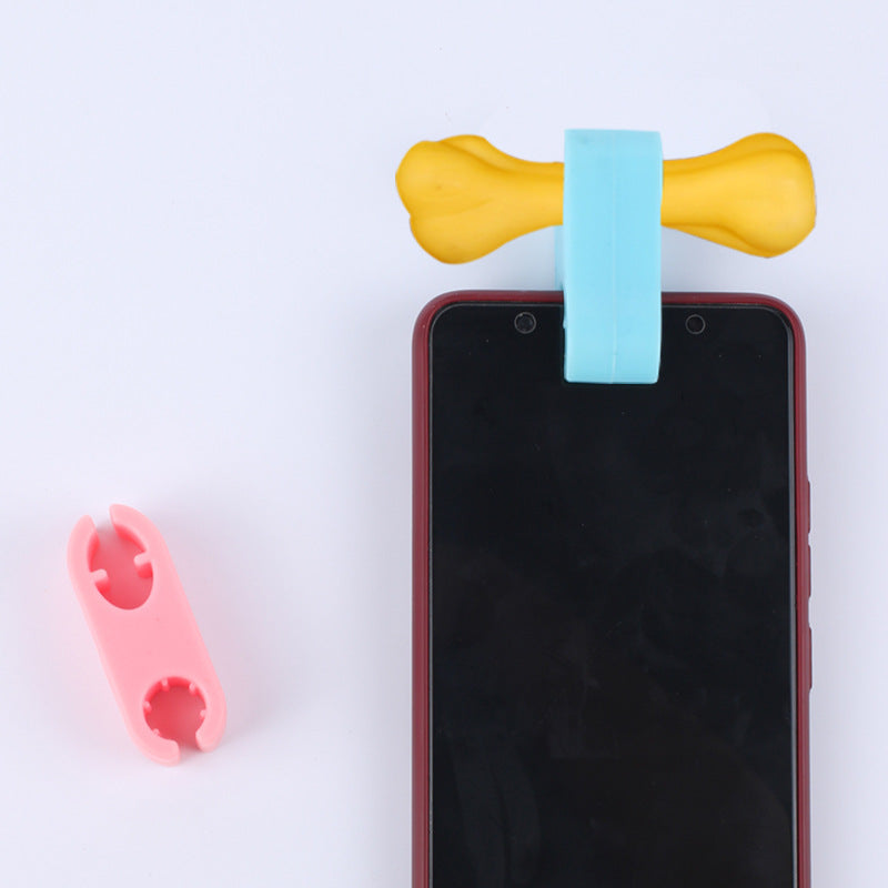 Pet selfie camera lens with yellow arms and blue phone clip attachment