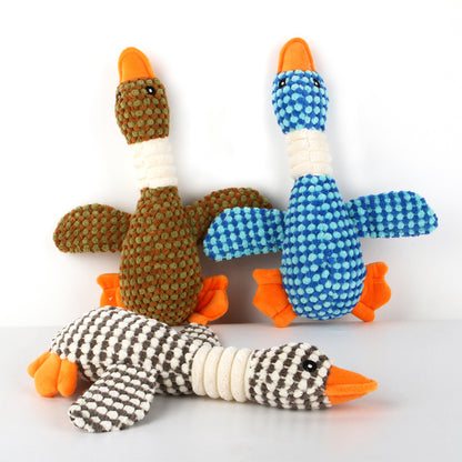 Plush dog molar cleaning toys: olive-and-orange, blue-and-orange, and black/white-striped