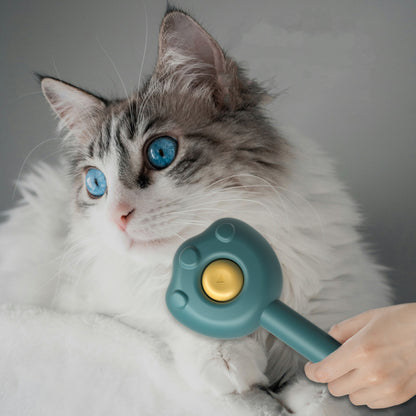 Petcare selbstreinigender Katzenkamm, blauer Griff, goldene Borstenfläche im Einsatz am Kätzchen