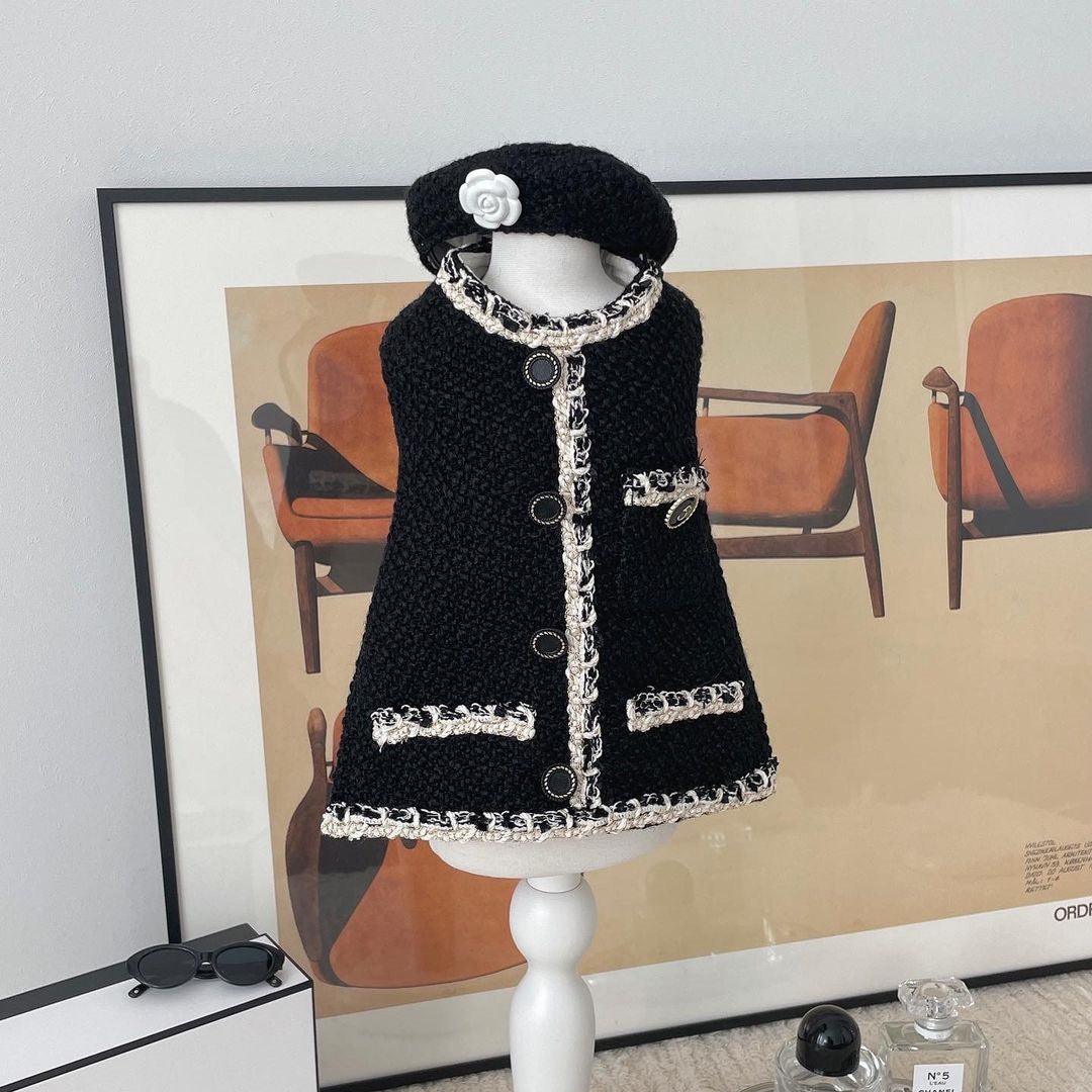 Black knitted pet hat with rose applique, shown with matching trim on garment