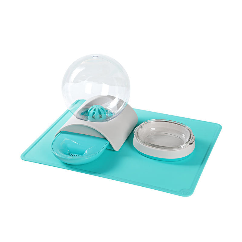 Pet feeding waterer set on teal mat with water globe, dish, and clear bowl