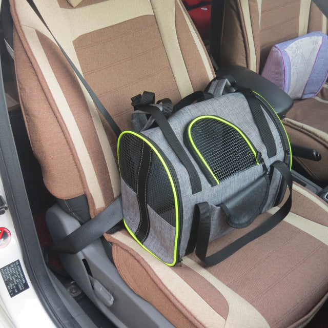Grey pet car seat carrier with neon green trim, secured with straps on the seat