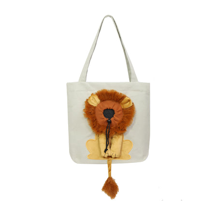 White pet carrier tote with lion face plush and dangling pom-pom tassel