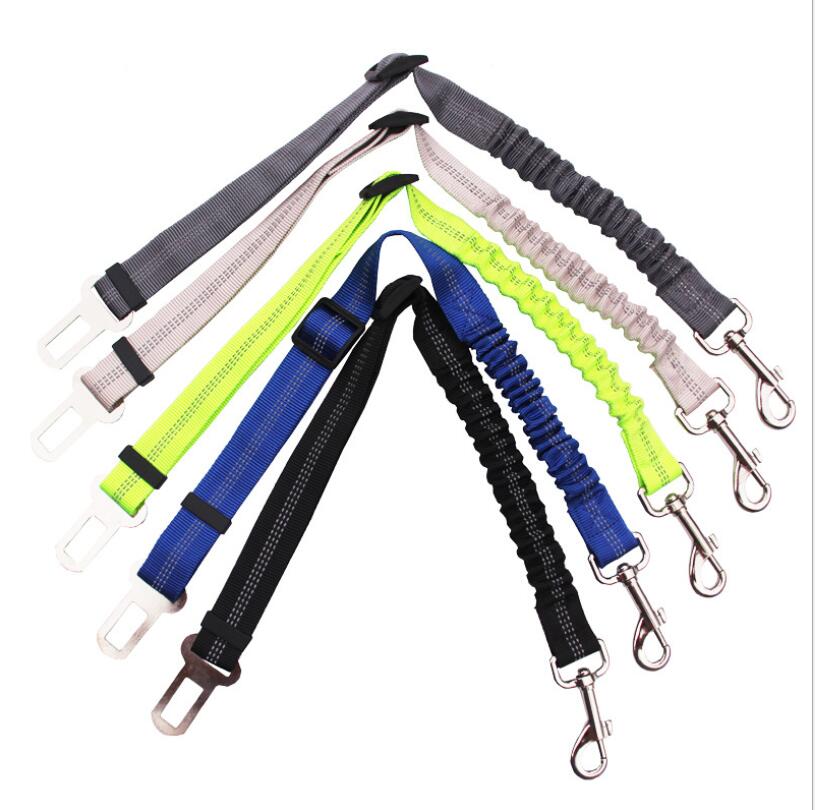 Set of adjustable reflective dog car seat belts with grey, neon green, blue, and black straps.