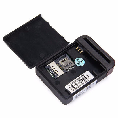 Black GPS Tracker opened case with exposed circuit board and SIM card slot