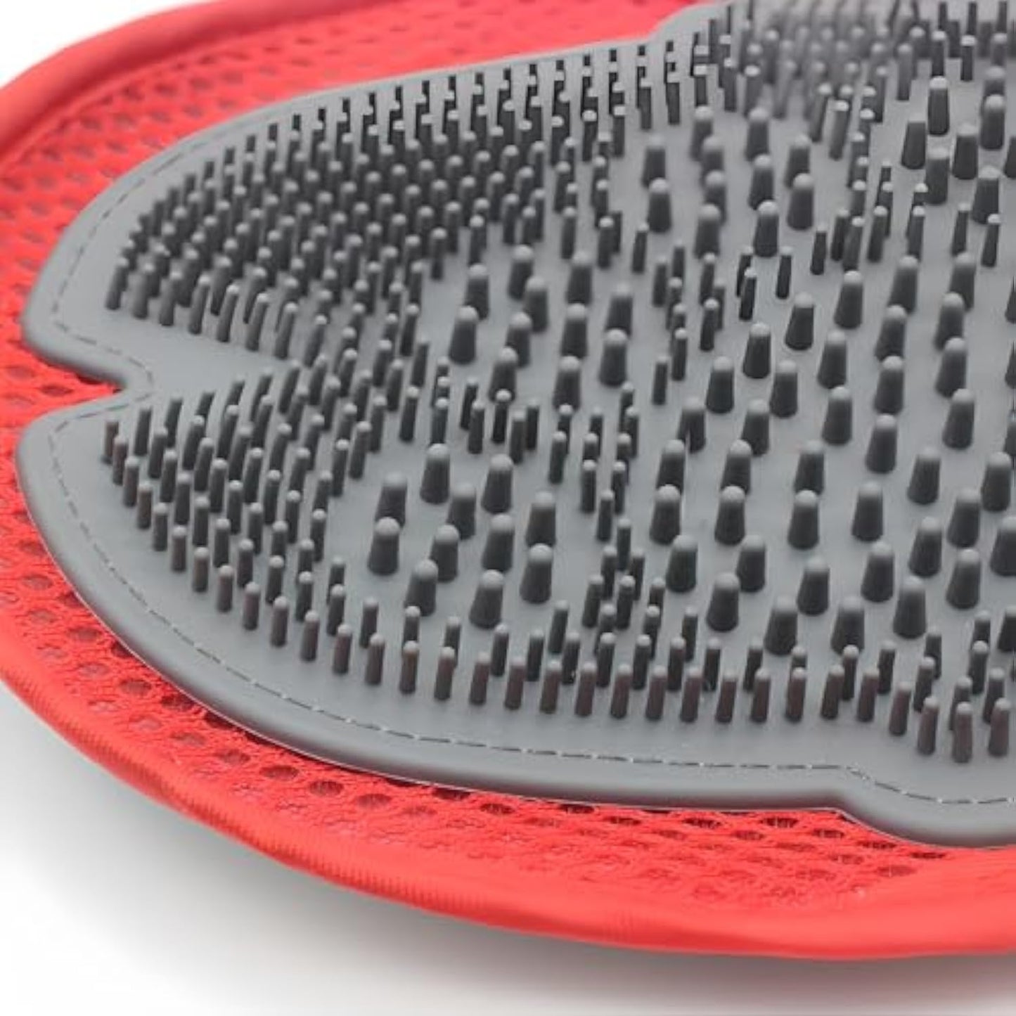 Red glove underside with dense gray nubs for deep pet hair removal