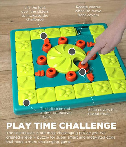Hand on dog puzzle feeding toy sliding tiles and rotating the center treat wheel