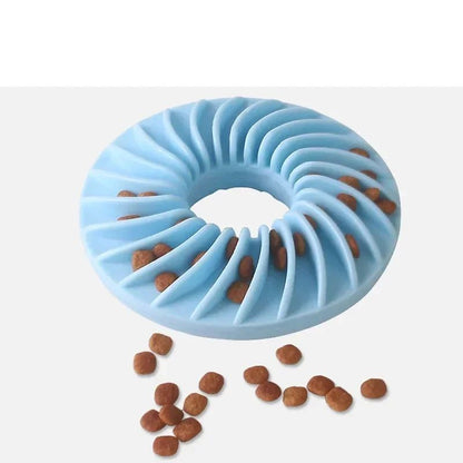 Blue ridged TPR feeding frisbee with kibble slots and scattered treats