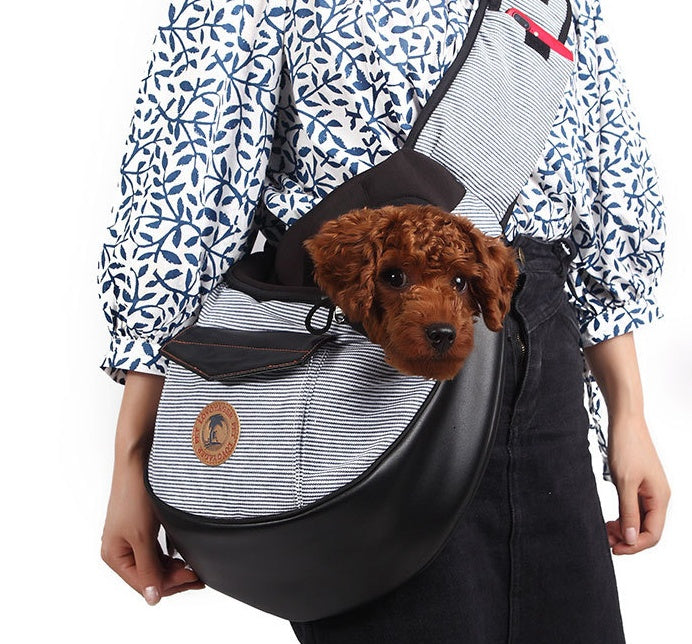 Grey Pet travel bag: black carrier with striped front panel, dog resting inside