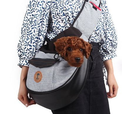 Grey Pet travel bag: black carrier with striped front panel, dog resting inside