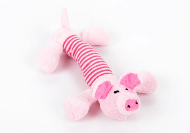 Funny dog squeak plush toy in pink with white striped body and small ear details