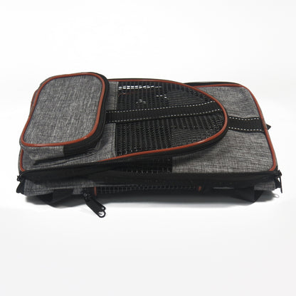 Grey pet carrier travel bag with mesh top window and brown/orange piping, zip closure