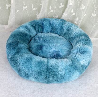 Blue round plush pet bed with deep cushioned center