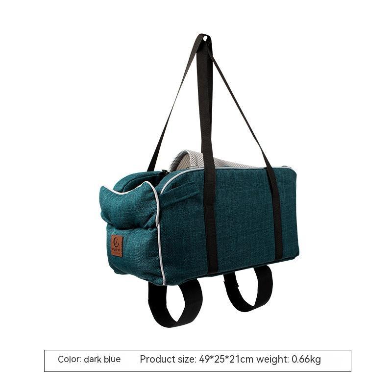 Dark blue pet tote carrier with black handles and stitched front pocket
