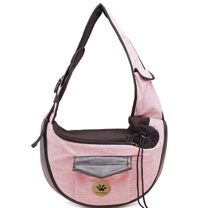 Pink Pet travel bag: striped hobo-style bag with black trim and paw badge