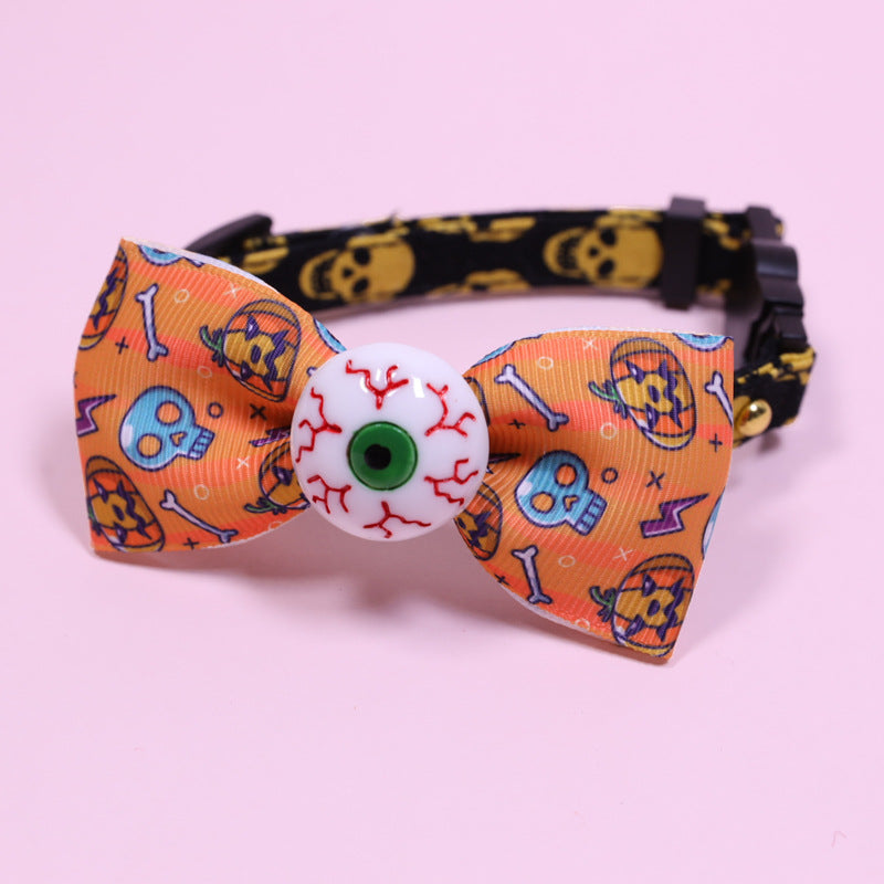 Pet Collar Halsband: orange Schleife mit Skelett-/Gruselmuster, runder weißer Augen-Button