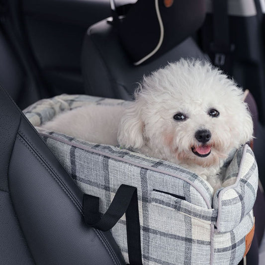 Car central control pet bag, plaid tote with black strap, holds a small dog