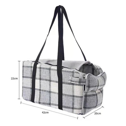 Plaid pet tote bag with black straps, side buckle detail, open top