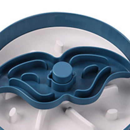 Close-up of blue rotating feeder insert with central spinner