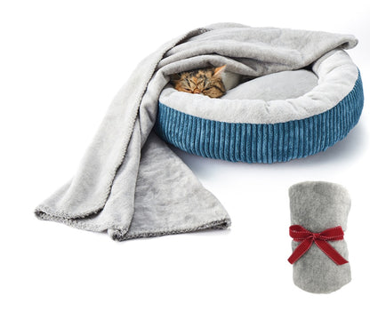 Grey flannel donut bed with blue ribbed edge and cat resting inside