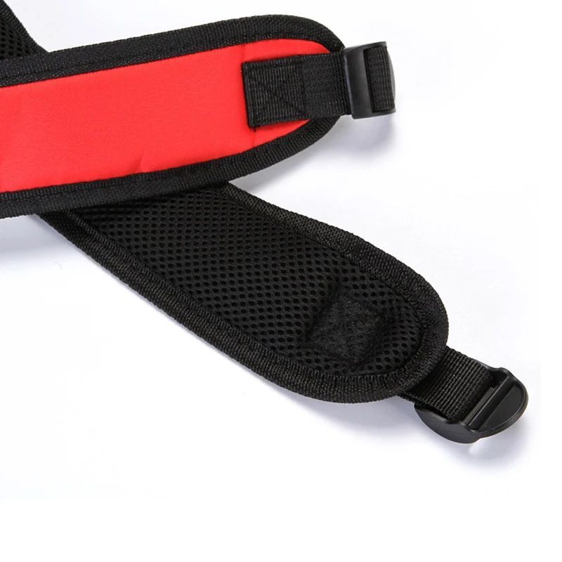 Red puppy carrier backpack with adjustable black shoulder strap and metal buckle