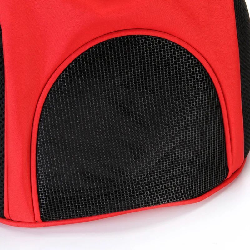 Red puppy carrier backpack close-up of breathable front mesh panel with trim