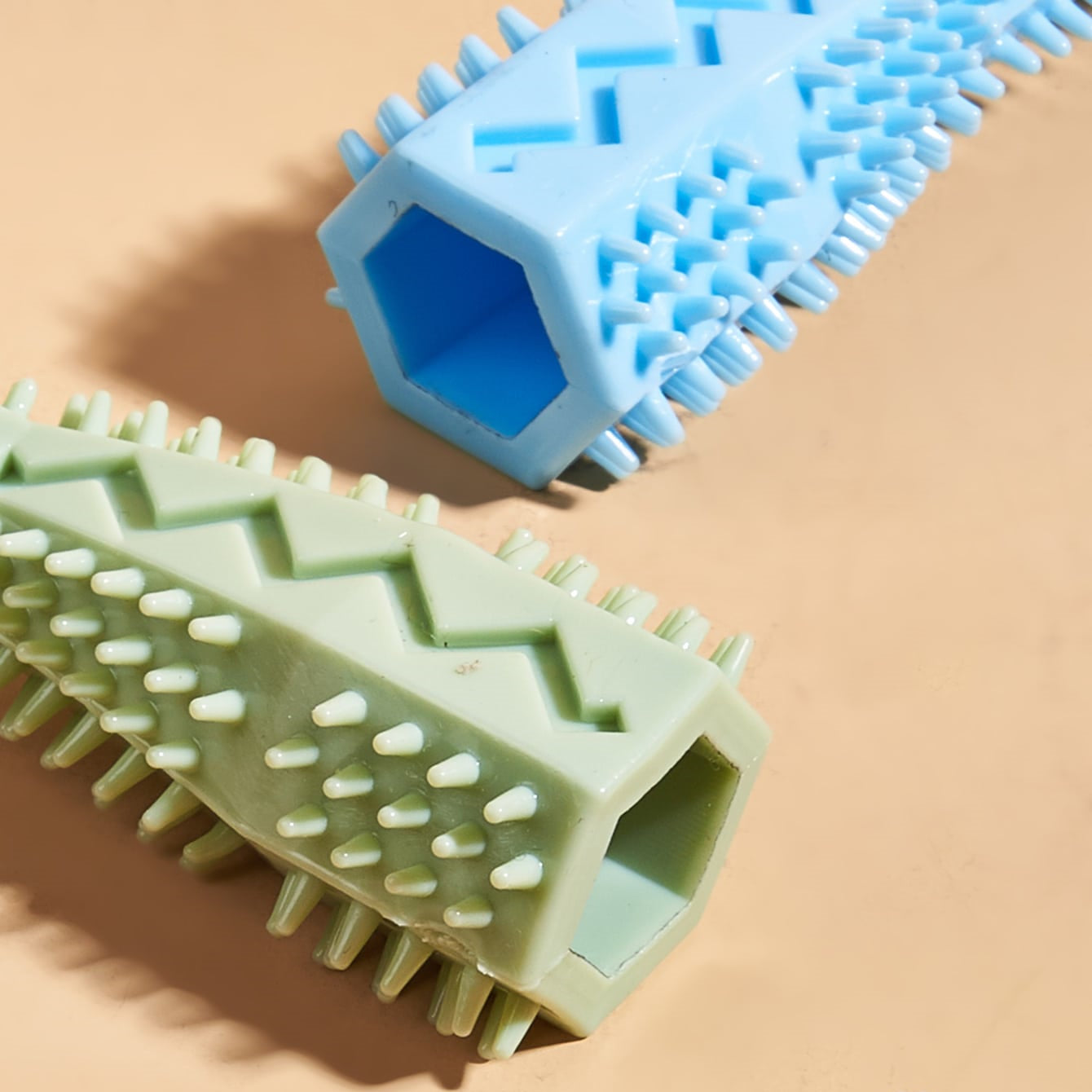 Close-up of blue chew toy with inner opening and raised bristle nubs
