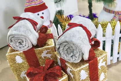 Grey flannel wrapped blanket rolls with red bows