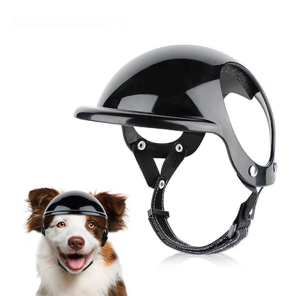 Black pet motorcycle safety helmet with clear face visor and chin strap, worn on dog