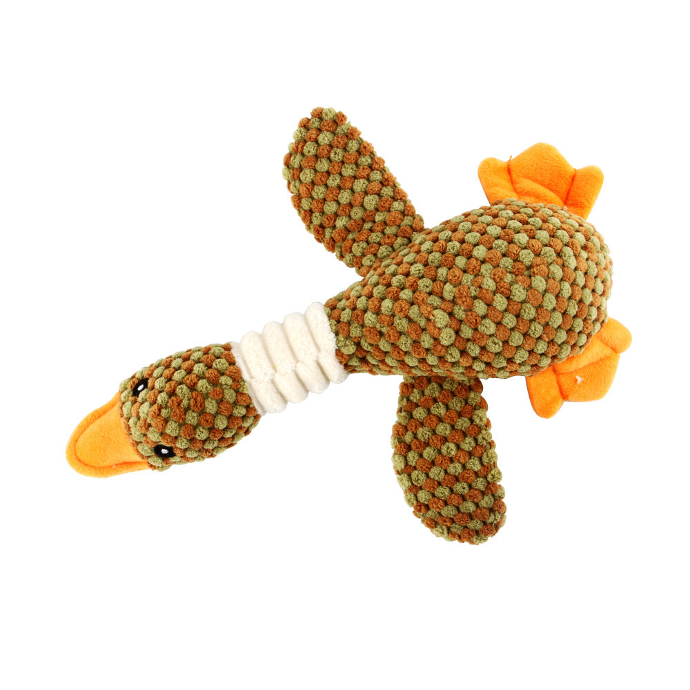 Brown-and-green spotted plush dog molar toy with orange flippers and rope grip.