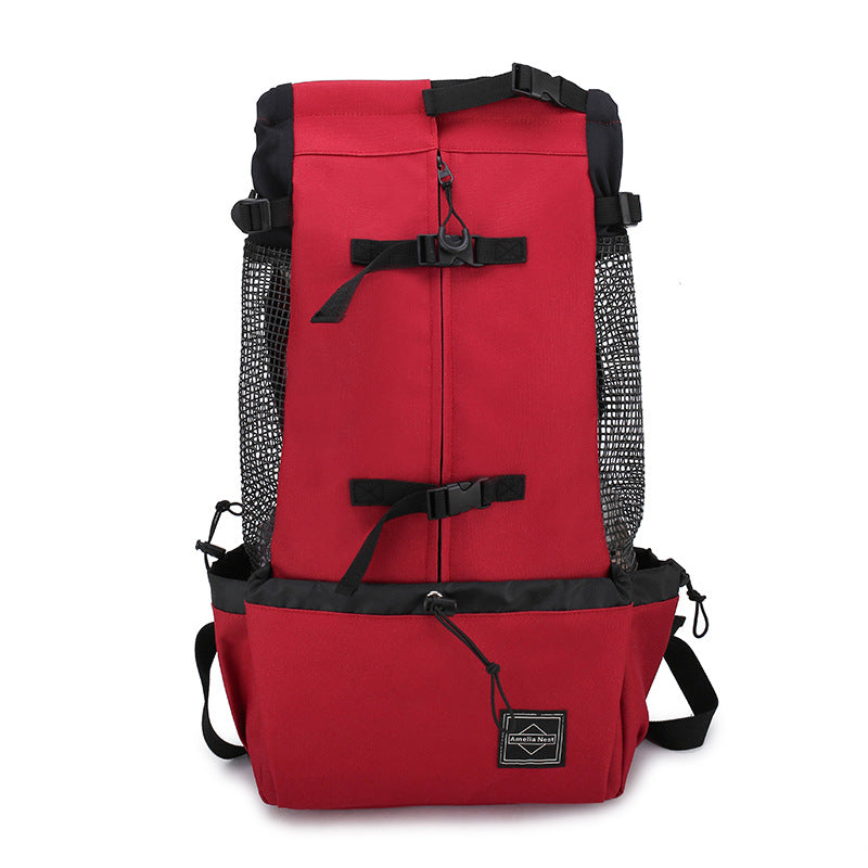Red dog carrier backpack with vertical zipper, top buckles, and front storage pouch
