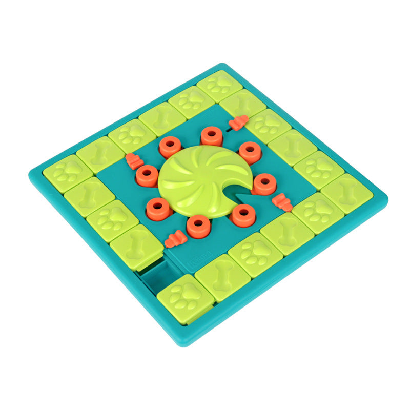 Dog puzzle feeding toy with lime tiles, teal base, and red ring pieces around wheel