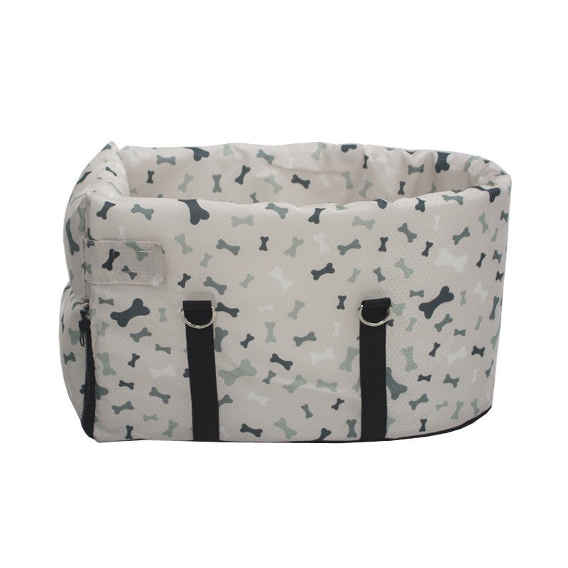 Car pet bed with bone print, black strap handles, buckled front panel