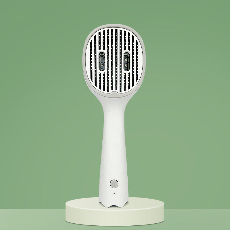 UVC sterilizing pet comb brush front view, needle teeth panel with dark green border