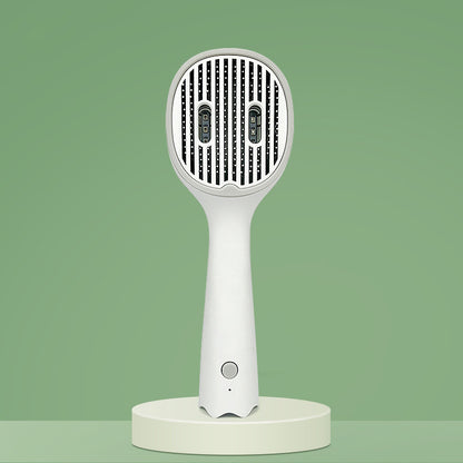UVC sterilizing pet comb brush front view, needle teeth panel with dark green border