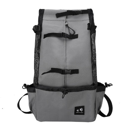 Light grey dog carrier backpack with black straps, mesh sides, and front pouch