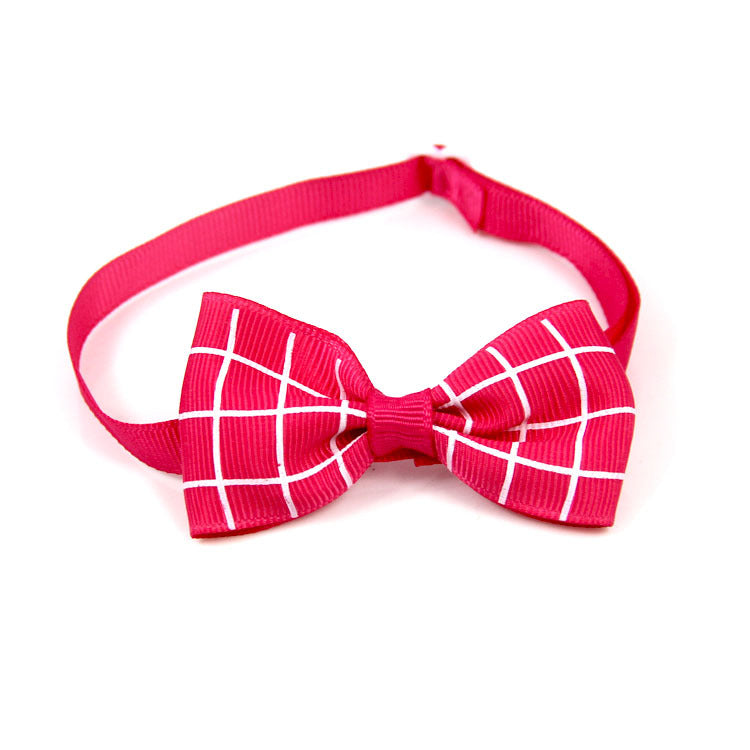 Plaid bow pet scarf accessory with bright pink strap and white grid check bow