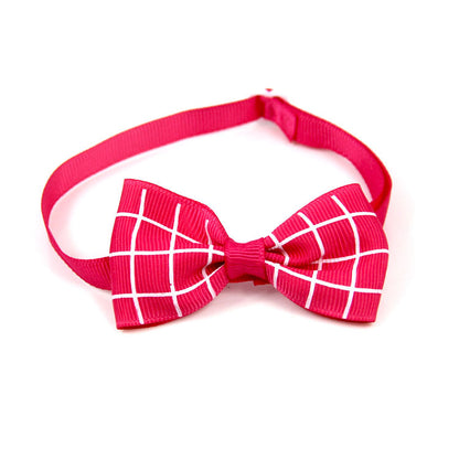 Plaid bow pet scarf accessory with bright pink strap and white grid check bow